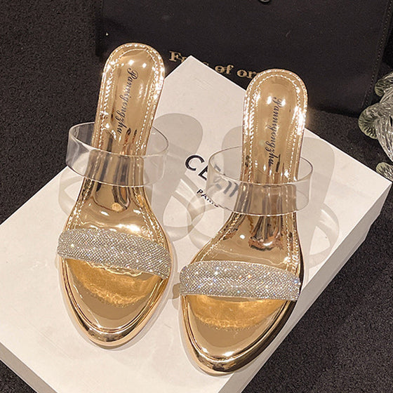 Transparente, hochhackige Hausschuhe mit Strasssteinen